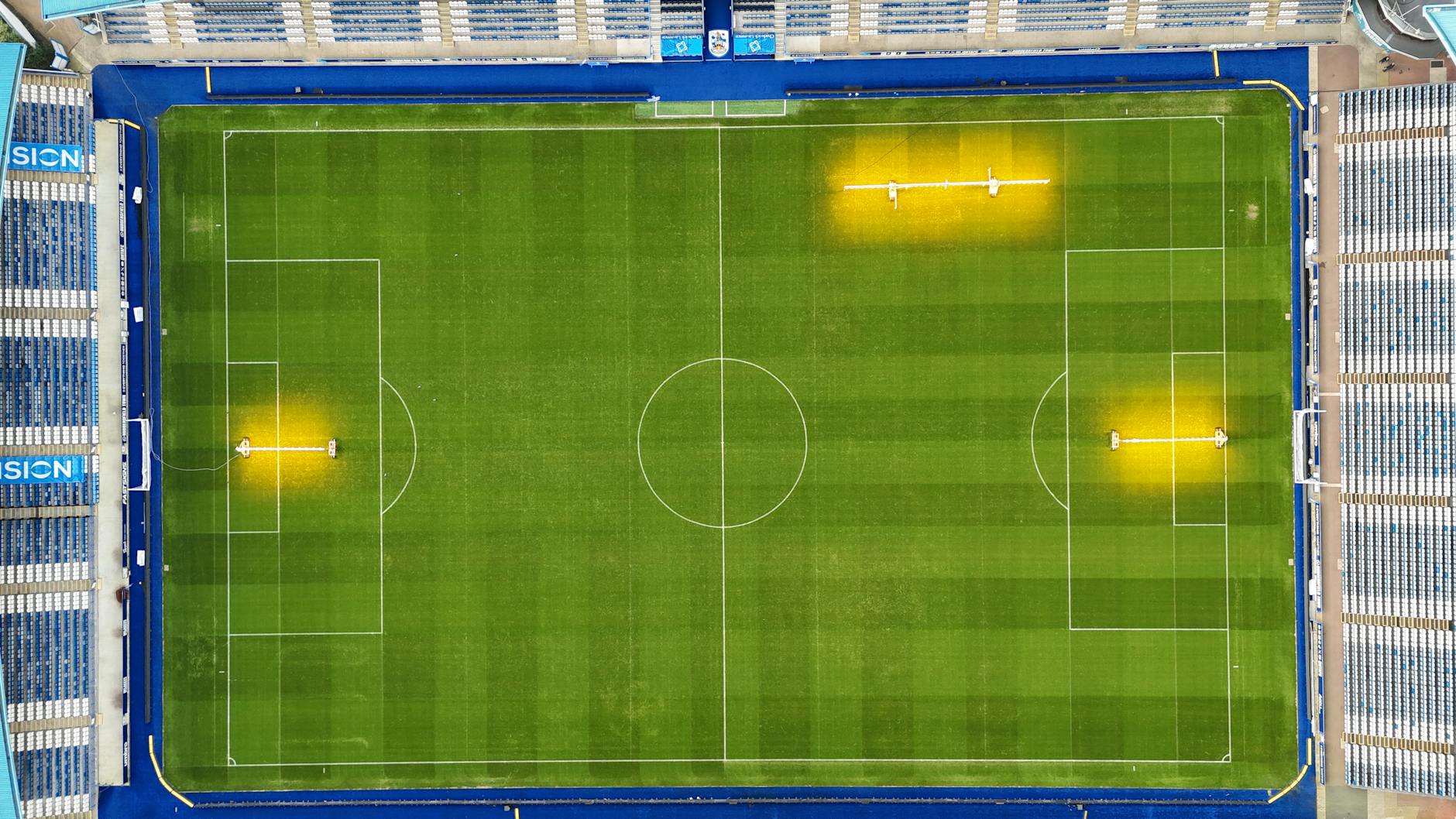 Top-down aerial view of a well-maintained football stadium.