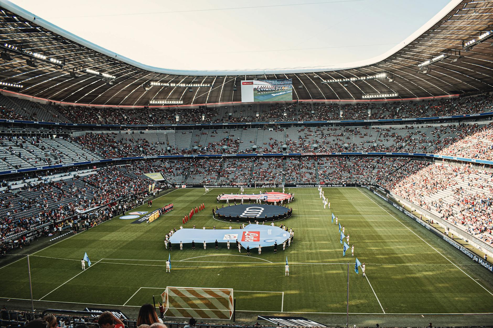 Captivating view of a soccer match at Munich's iconic Allianz Arena, filled with excited fans.