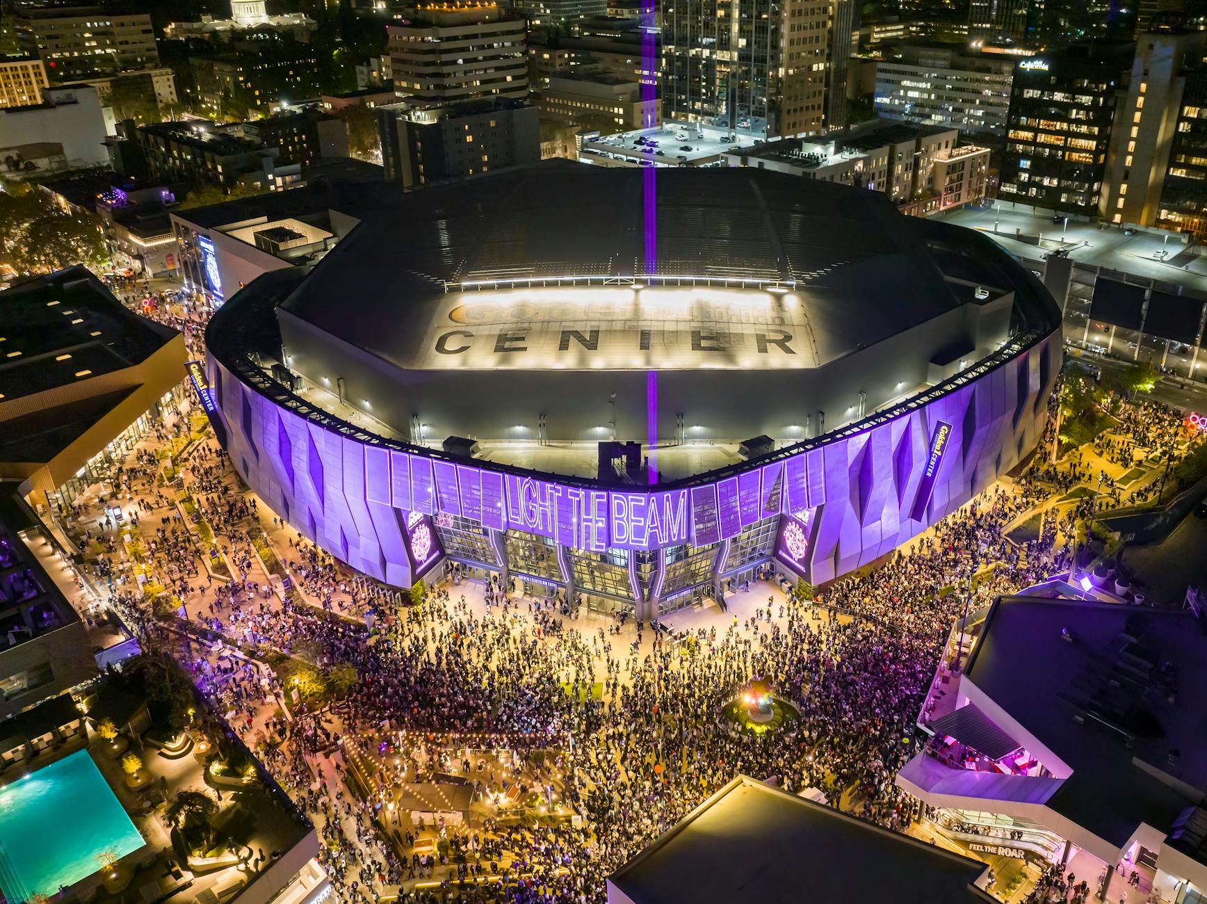 Vibrant aerial night view of a crowded stadium with illuminated surroundings in Sacramento, California.